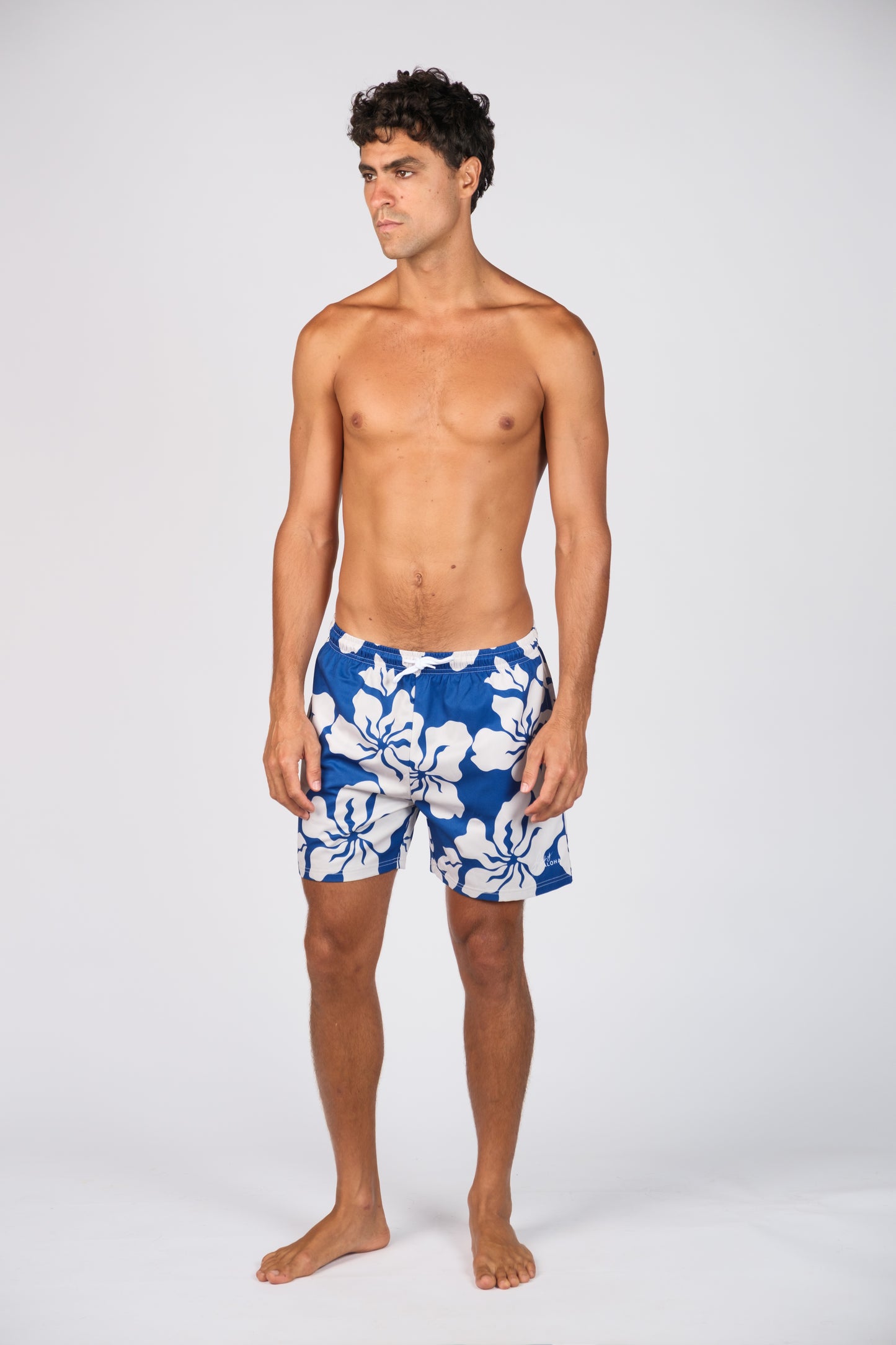 BILLY ALOHA HAZE SWIM TRUNKS. BLUE AND WHITE HIBISCUS PRINT.