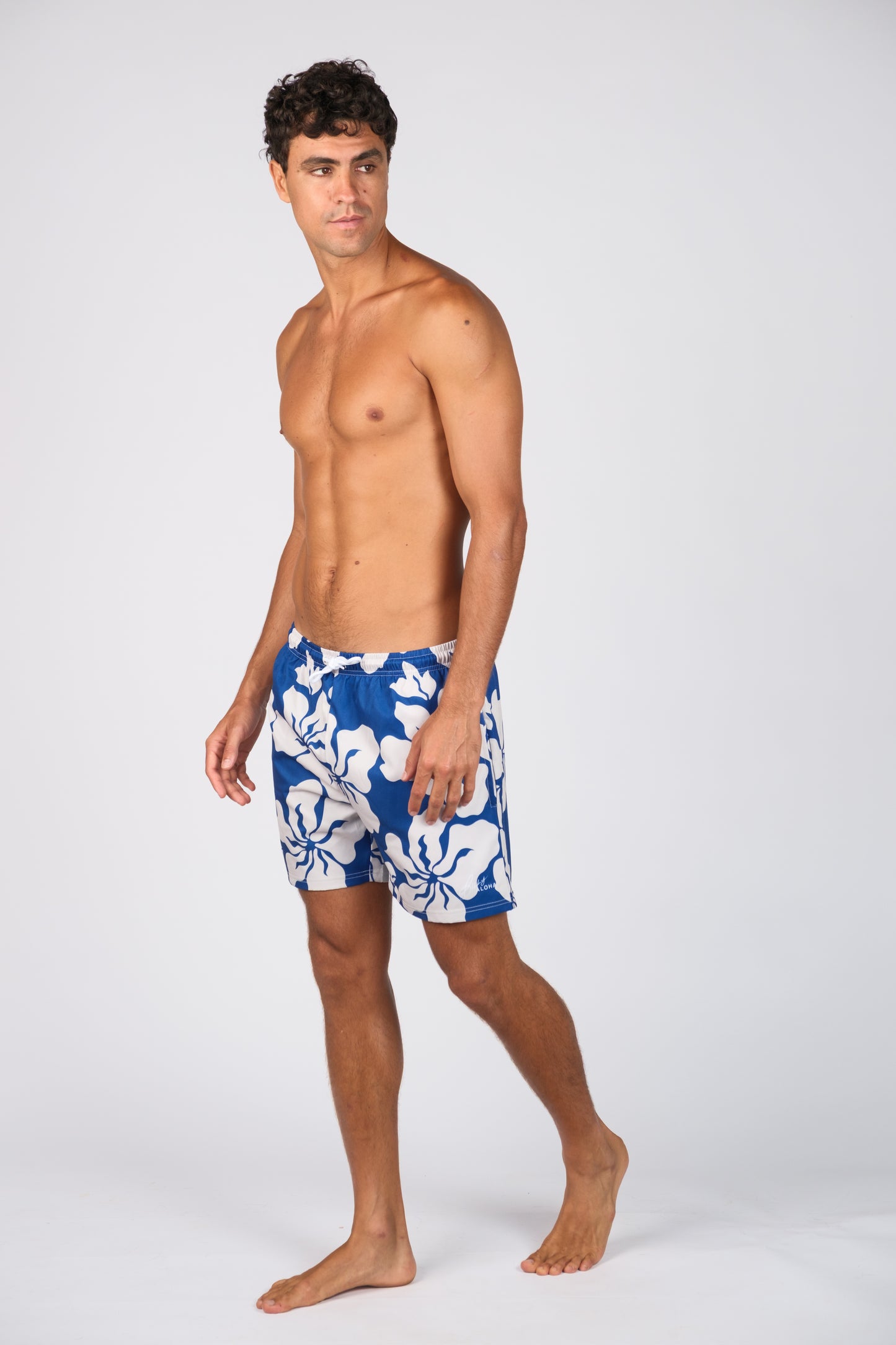 BILLY ALOHA HAZE SWIM TRUNKS. BLUE AND WHITE HIBISCUS PRINT.