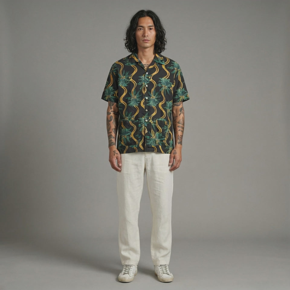 Delirium Shirt. Short-sleeve shirt with a tropical pattern on a white background